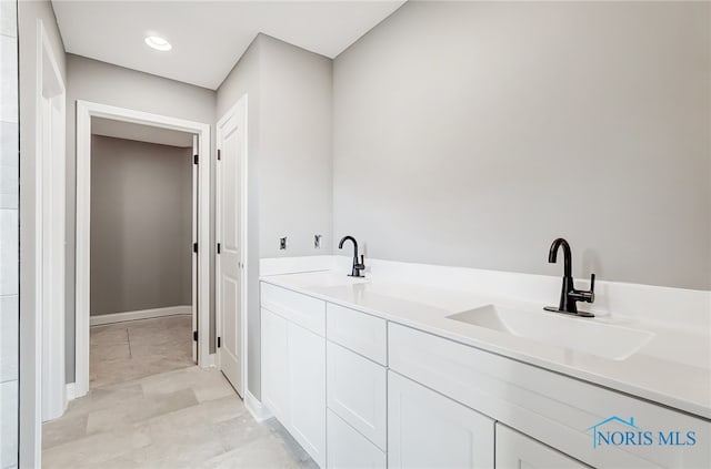 bathroom with vanity and tile patterned flooring