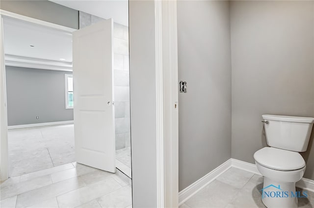 bathroom with tile patterned flooring and toilet