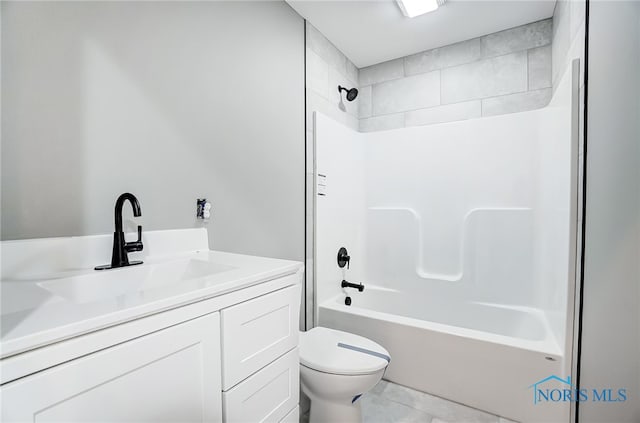 full bathroom with tiled shower / bath combo, vanity, toilet, and tile patterned floors