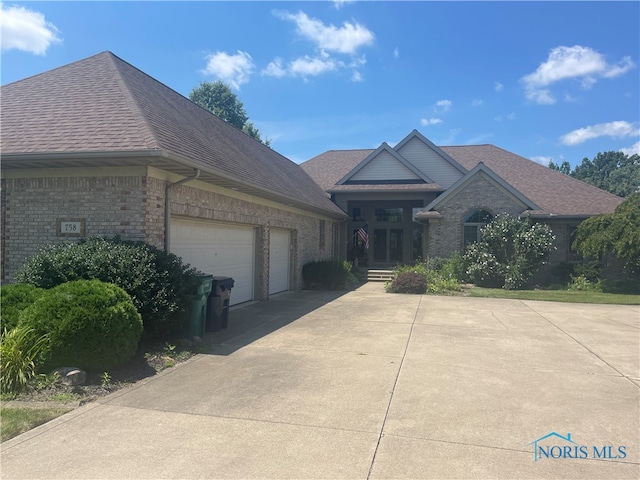 view of side of property with a garage