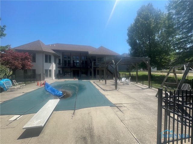 view of pool with a pergola and a patio