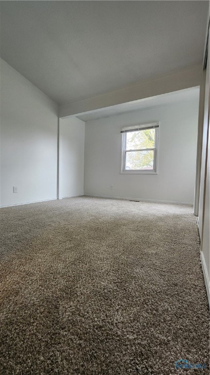 empty room featuring carpet flooring