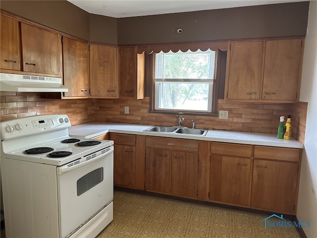 kitchen with white electric range oven, sink, and decorative backsplash