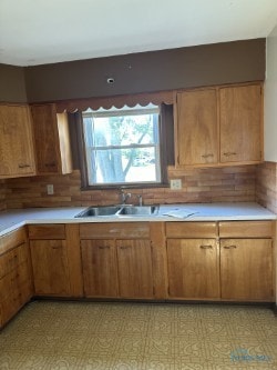 kitchen with tasteful backsplash and sink