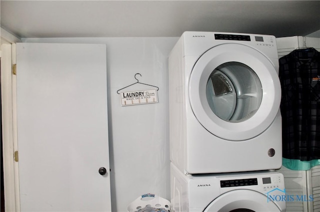 laundry area with stacked washer / dryer