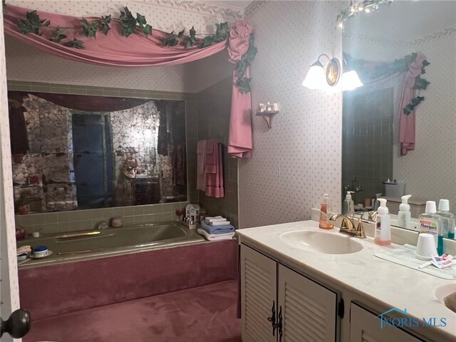 bathroom featuring vanity and a bathing tub