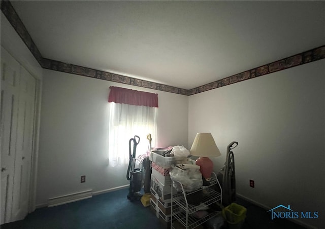 unfurnished bedroom featuring dark colored carpet