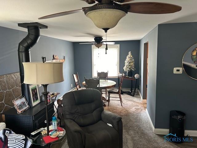 living room featuring ceiling fan and carpet floors