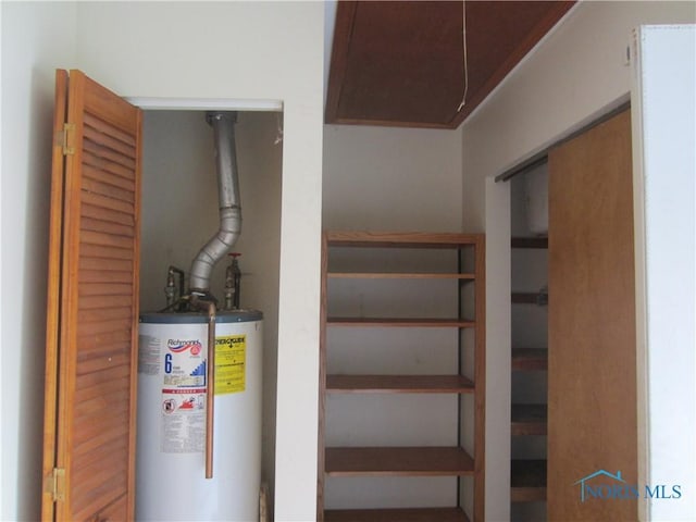 utility room featuring gas water heater