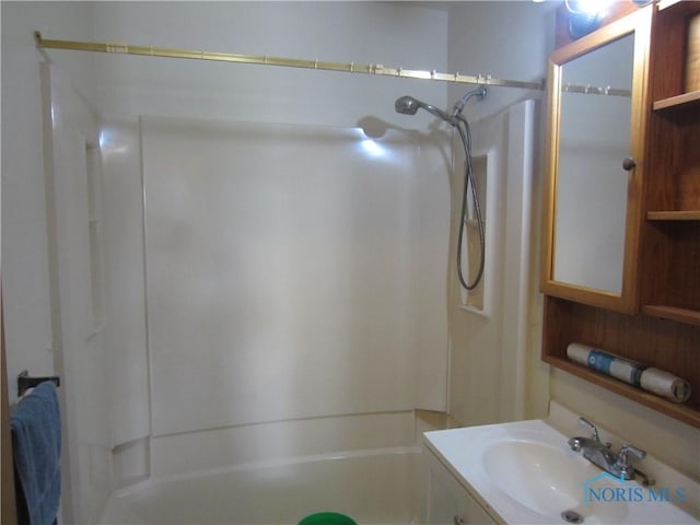 bathroom featuring bathing tub / shower combination and vanity