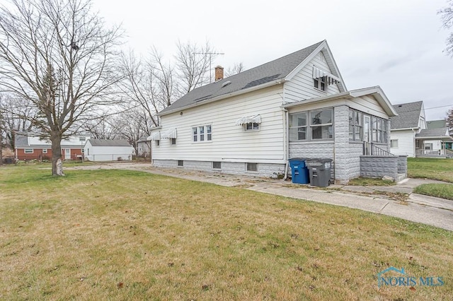 view of home's exterior featuring a lawn