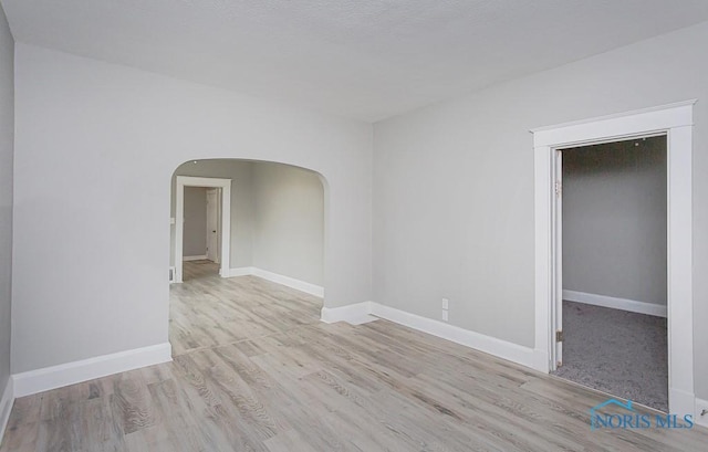 spare room featuring light hardwood / wood-style floors