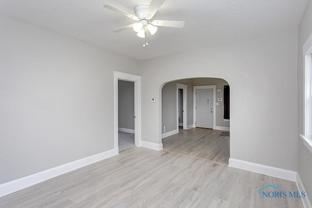 unfurnished room with light hardwood / wood-style flooring and ceiling fan