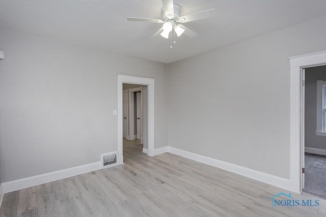 unfurnished room with light hardwood / wood-style floors and ceiling fan