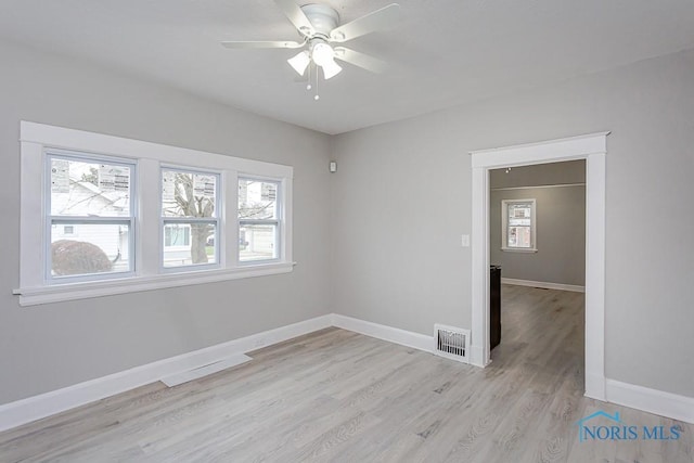 unfurnished room featuring ceiling fan and light hardwood / wood-style flooring