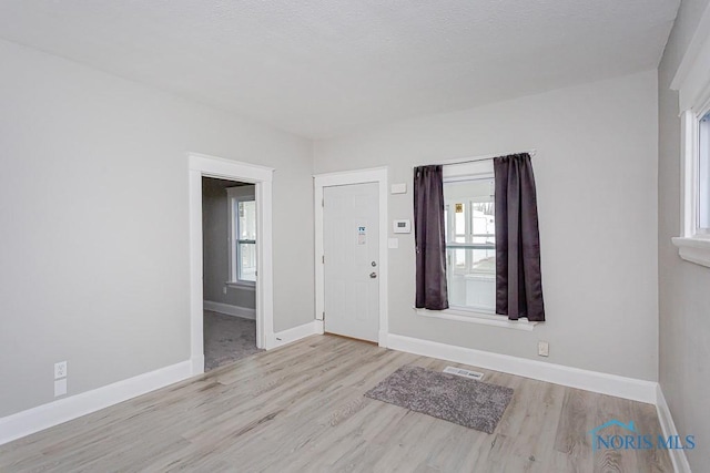 foyer entrance featuring light hardwood / wood-style floors