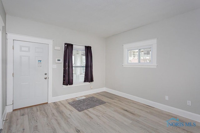 foyer entrance featuring light hardwood / wood-style flooring