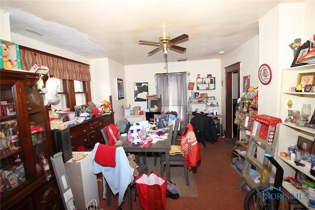 carpeted dining space featuring ceiling fan