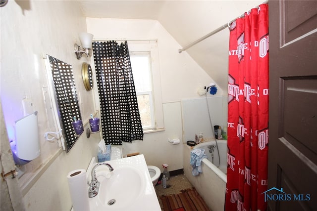 full bathroom with sink, toilet, a wealth of natural light, and shower / bath combination with curtain