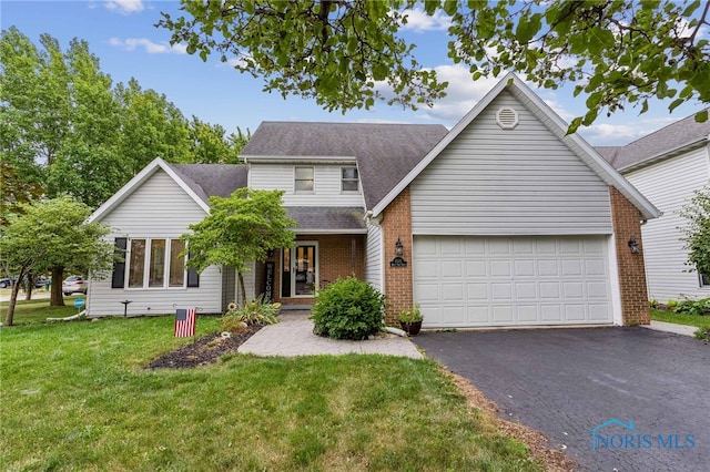 front facade with a garage and a front lawn