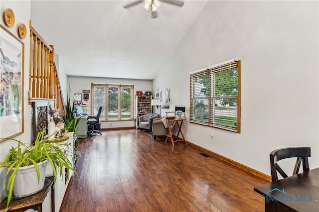 sitting room with vaulted ceiling, ceiling fan, and dark hardwood / wood-style floors