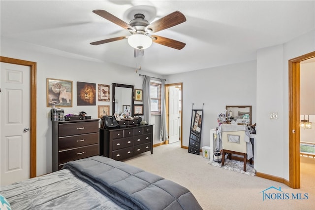 bedroom featuring ceiling fan and light colored carpet