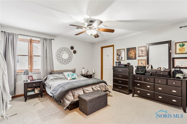 carpeted bedroom featuring ceiling fan