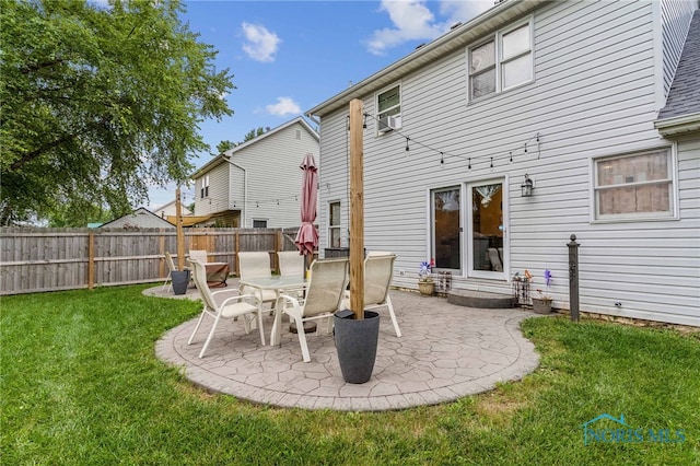 back of property featuring a yard and a patio