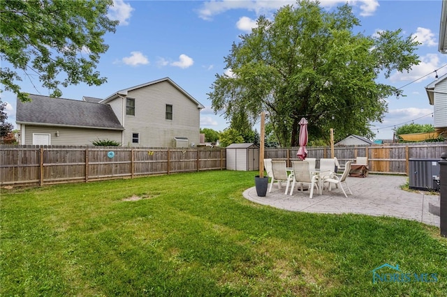 view of yard with a patio area and a shed