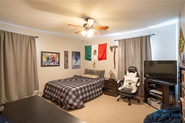 carpeted bedroom with ceiling fan