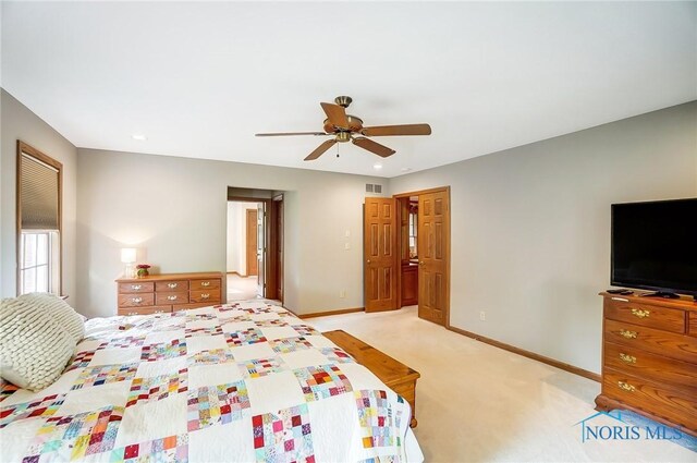 bedroom with ceiling fan and light colored carpet