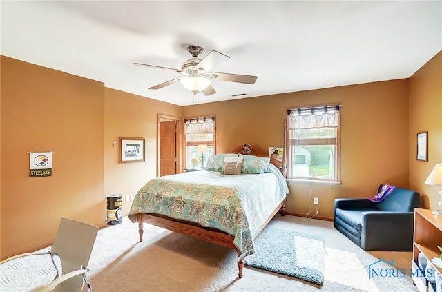 carpeted bedroom with ceiling fan