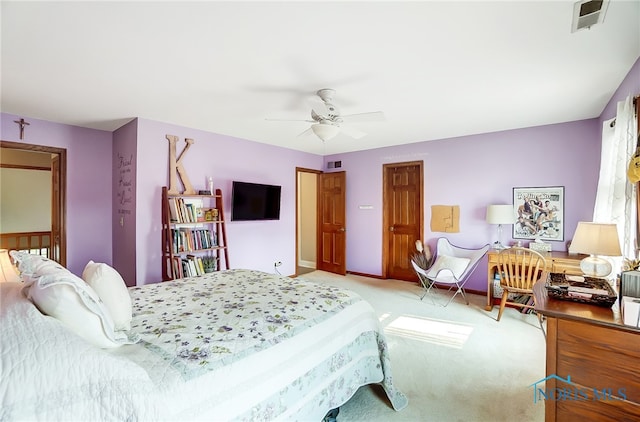 bedroom with light carpet and ceiling fan