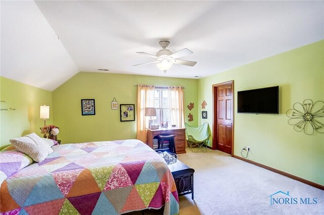 bedroom with lofted ceiling, light carpet, and ceiling fan