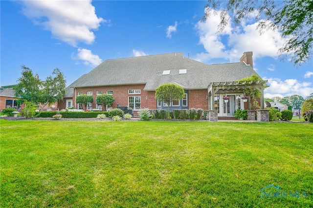 view of front of house with a front lawn and a pergola