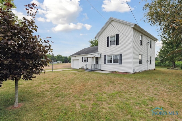 rear view of property featuring a yard