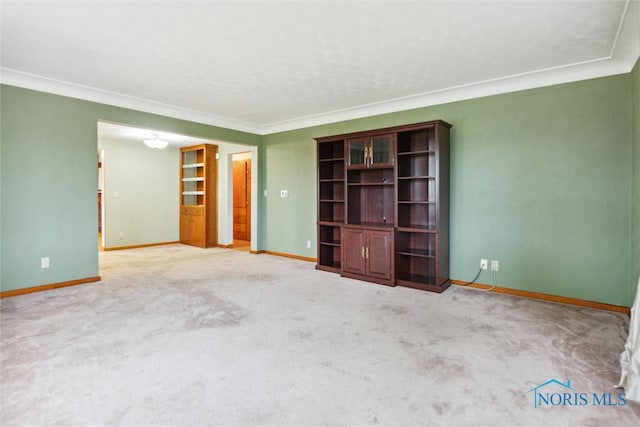 unfurnished bedroom featuring light colored carpet and crown molding