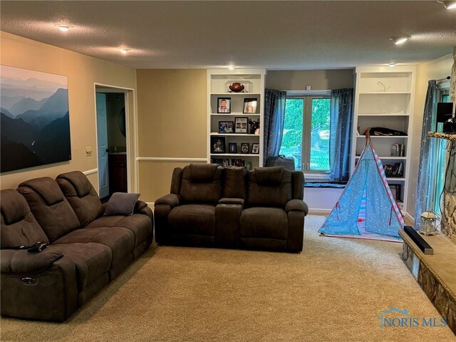 living room featuring built in features, a textured ceiling, and carpet flooring