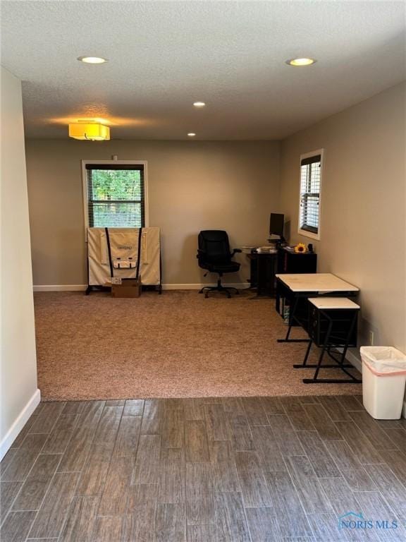 home office featuring dark wood-style floors, baseboards, a textured ceiling, and recessed lighting