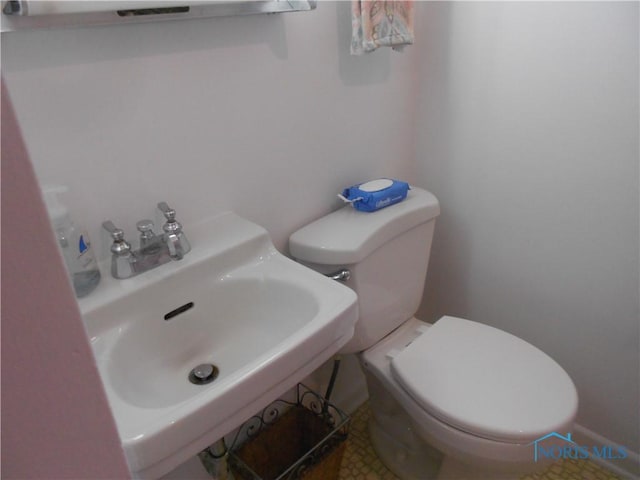 bathroom with toilet and sink