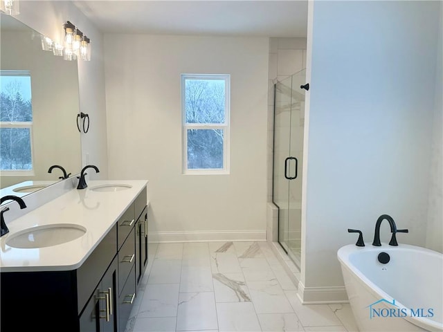 full bathroom with marble finish floor, a sink, and a shower stall