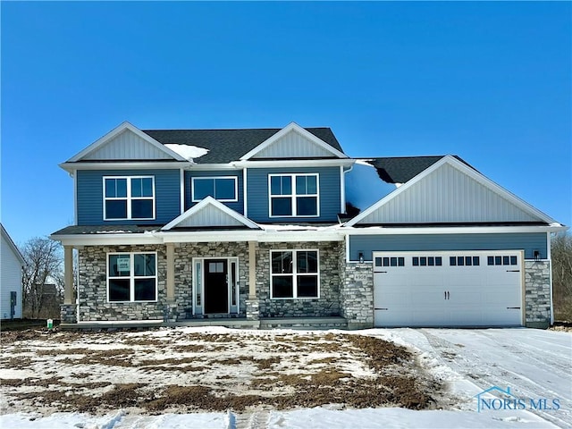 craftsman inspired home featuring a garage, stone siding, a shingled roof, and board and batten siding