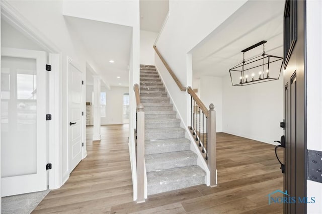 entrance foyer with stairs, recessed lighting, and light wood finished floors