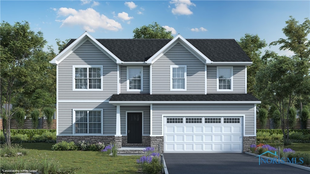 view of front facade featuring a garage and a front lawn