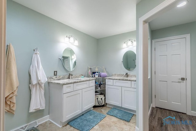 bathroom with visible vents and vanity