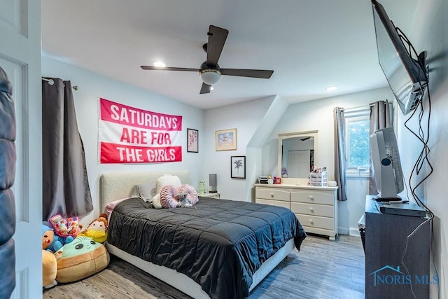 bedroom featuring ceiling fan, light wood finished floors, and recessed lighting