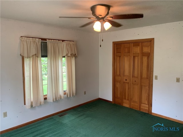 unfurnished bedroom featuring ceiling fan, carpet flooring, and a closet