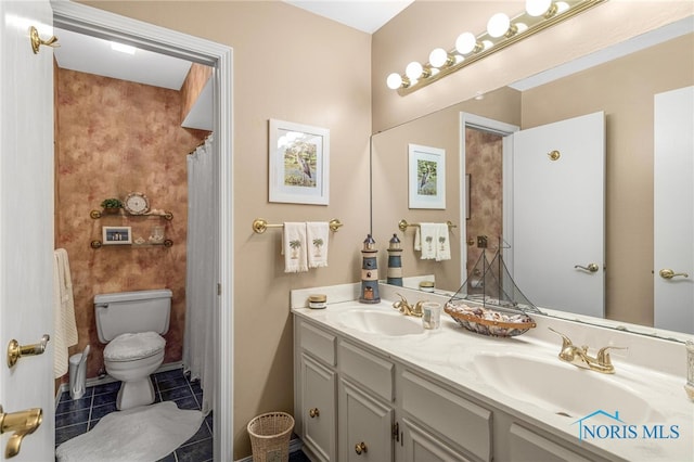 bathroom featuring tile patterned flooring, dual bowl vanity, and toilet