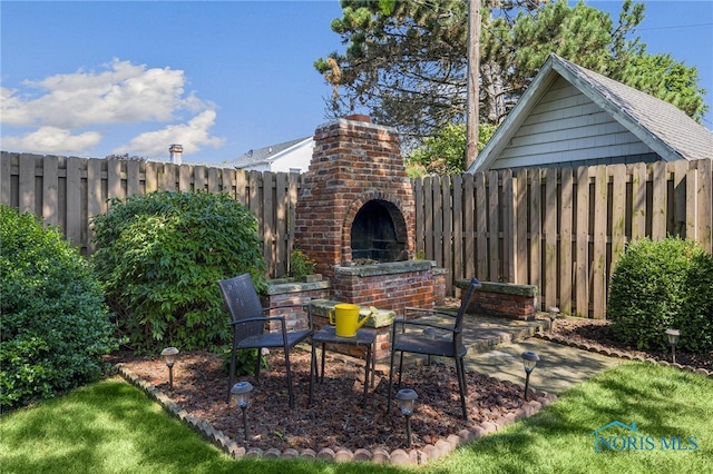 view of patio with an outdoor brick fireplace