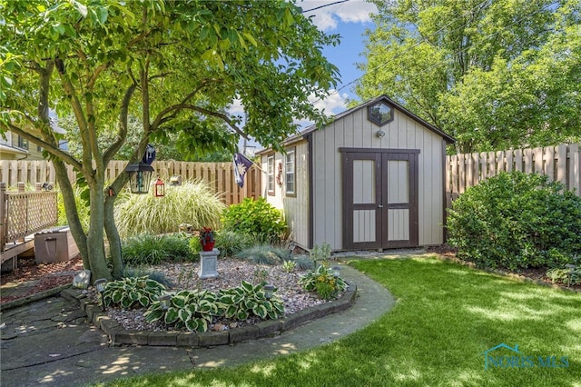 view of outbuilding with a yard